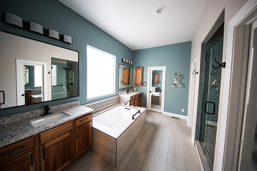 Modern Master Bathroom with Teal Walls and Double Vanity