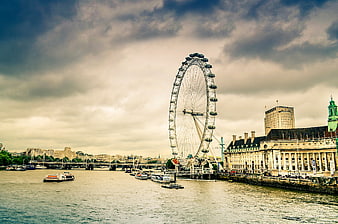 London Eye Ferris Wheel on River Thames with Boats