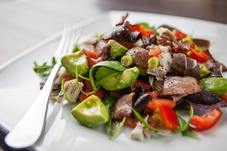 Fresh Bacon Avocado Salad on White Plate