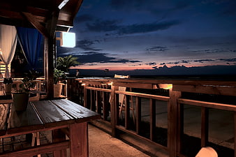 Wooden Balcony at Sunset with Ocean View