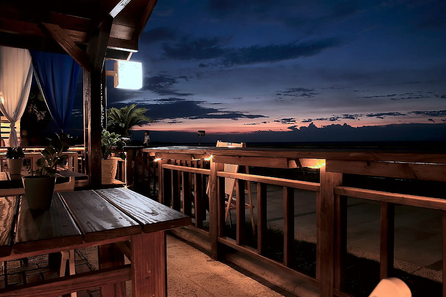 Wooden Balcony at Sunset with Ocean View