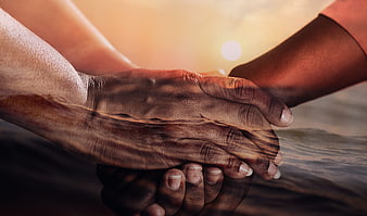 Double Exposure of Holding Hands and Ocean Sunset