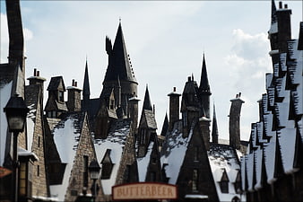 Snowy Medieval Castle Architecture With Butterbeer Sign