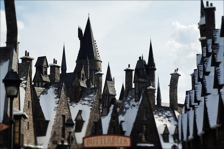 Snowy Medieval Castle Architecture With Butterbeer Sign