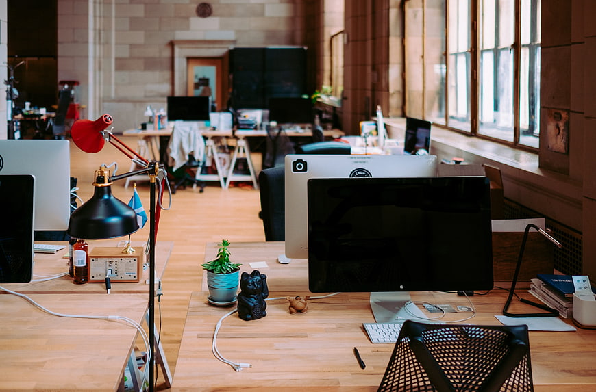 Modern Creative Office Workspace With Wooden Desks And Computers