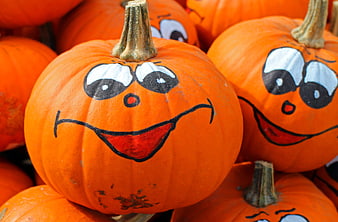 Close-up of painted smiling pumpkins for Halloween decoration