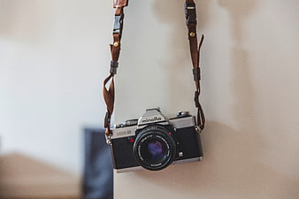 Vintage Minolta Film Camera Hanging on Wall