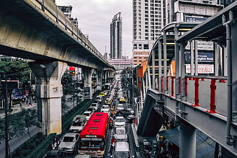 Heavy Traffic Congestion on Bangkok Street with Elevated Skytrain