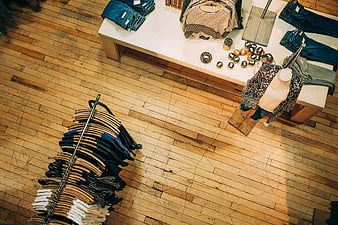 High angle view of boutique clothing store interior with wooden floor