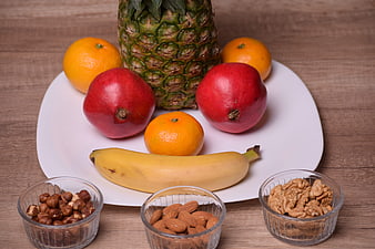 Healthy Fruit and Nut Platter on White Plate