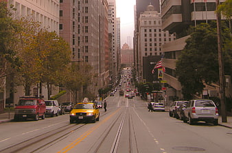 San Francisco Street with Cable Car Tracks and Yellow Taxi