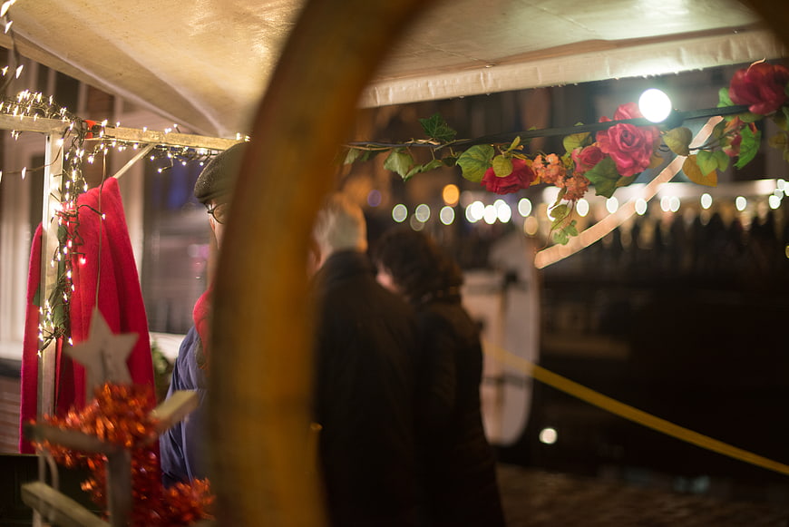 Christmas Market Stall View Through Wooden Arch