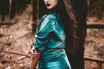 Woman in Denim Jacket in Forest with Red Lipstick