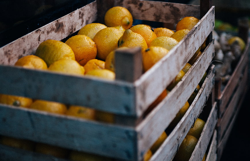 Fresh Lemons in Rustic Wooden Crates at Market