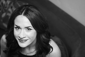 Black and white portrait of smiling brunette woman