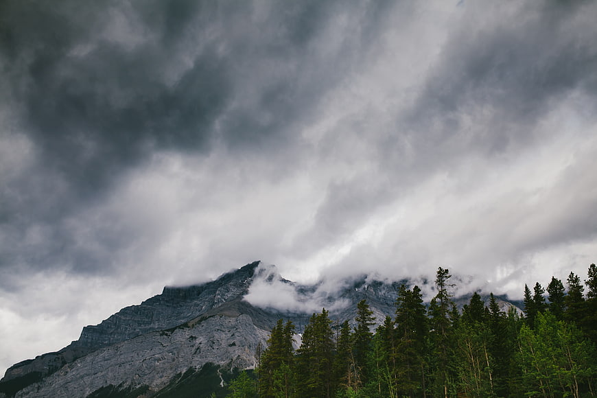 Dramatic Stormy Mountain Landscape with Pine Forest