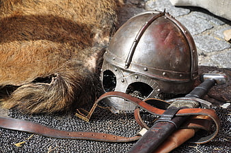 Medieval Viking Helmet, Sword, and Chainmail Armor on Fur