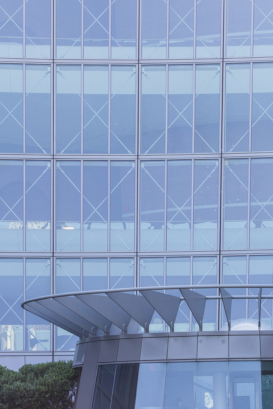 Modern Glass Office Building Facade with Geometric Pattern