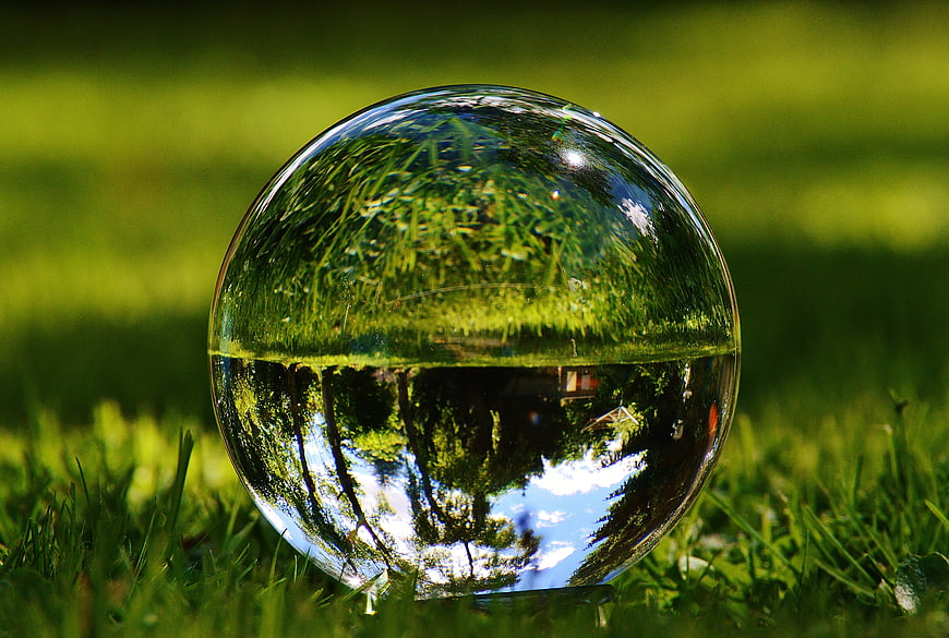 Glass Sphere Reflection In Green Grass Meadow