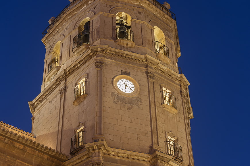Illuminated Historic Bell Tower Against Deep Blue Night Sky