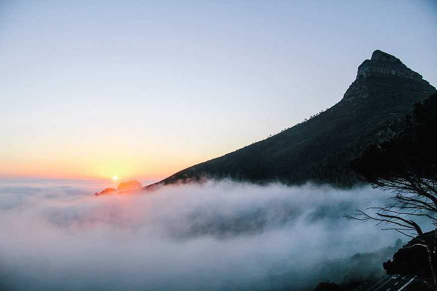 Mountain Peak Rising Above Sea of Fog at Sunrise