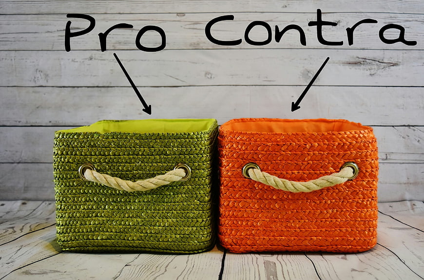 Green and Orange Woven Storage Baskets on White Wood Background