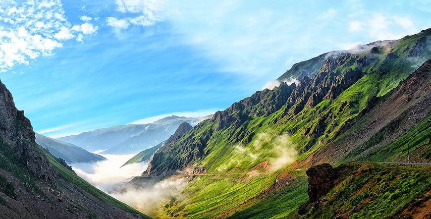 Panoramic View of Green Mountain Valley with Morning Mist