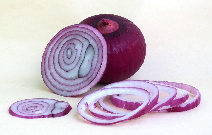 Sliced Red Onion With Rings On White Background