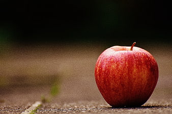 Red Apple on Wooden Surface with Copyspace