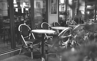 Empty black and white cafe terrace with bistro chairs