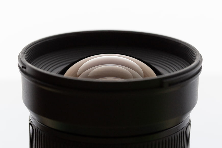 Close-up of camera lens aperture blades on white background