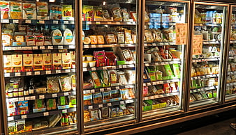 Supermarket refrigerated aisle with packaged food products