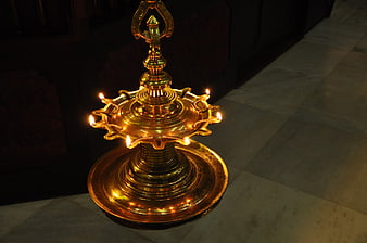 Traditional Brass Oil Lamp with Lit Flames