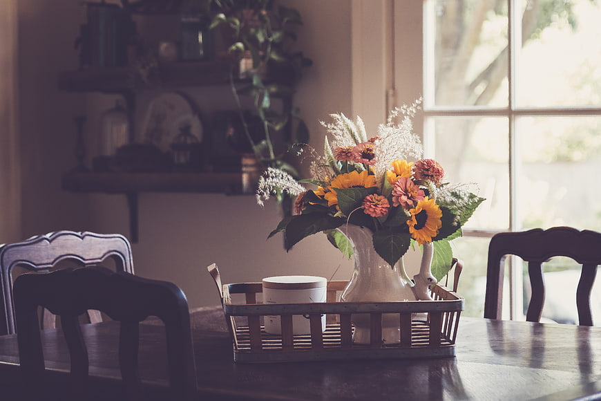 Rustic Sunflower Bouquet in White Vase on Wooden Dining Table