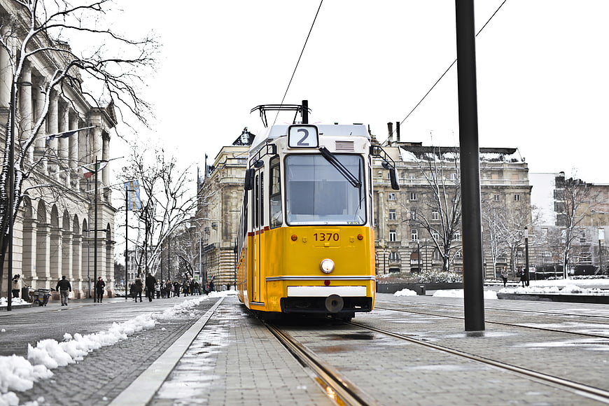 Yellow Vintage Tram on Snowy City Street