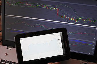 Financial Trading Charts On Laptop And Tablet Screen