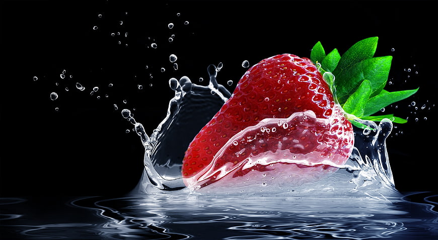 Fresh Strawberry Splashing into Water on Black Background