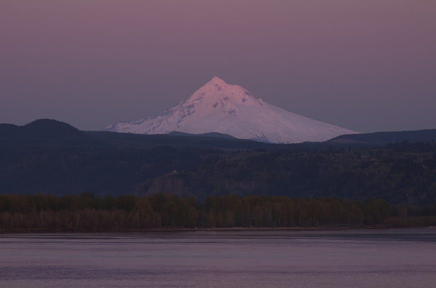 Snow-Capped Mountain at Dusk Over Calm Water