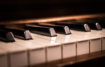 Close-up of vintage piano keys with shallow depth of field