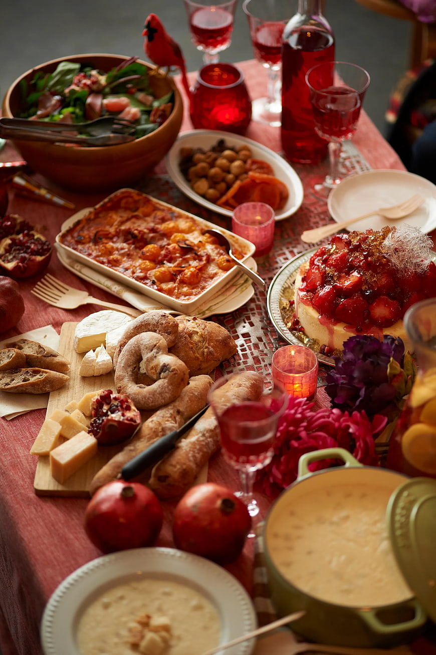 Festive Holiday Table Setting with Cheese, Bread, and Red Wine