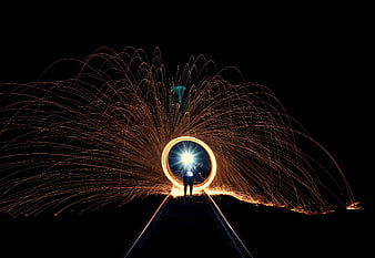 Steel wool photography on railway tracks at night