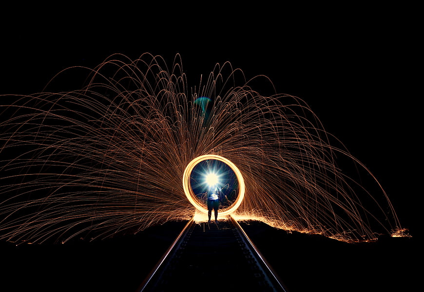 Steel wool photography on railway tracks at night