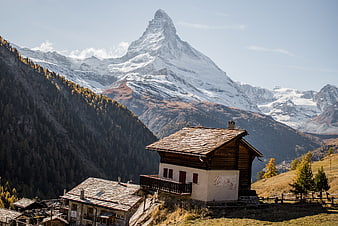 Matterhorn Mountain View With Alpine Village Houses In Switzerland