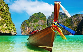 Traditional Thai Longtail Boat in Turquoise Tropical Lagoon