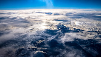 Aerial View of Clouds and Mountains from Above