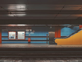 Empty Berlin U-Bahn Station Platform with Blue and Orange Tiles