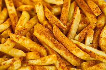 Close-Up of Seasoned French Fries with Paprika and Herbs