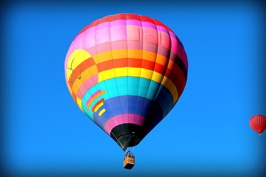 Colorful Hot Air Balloon Flying in Blue Sky