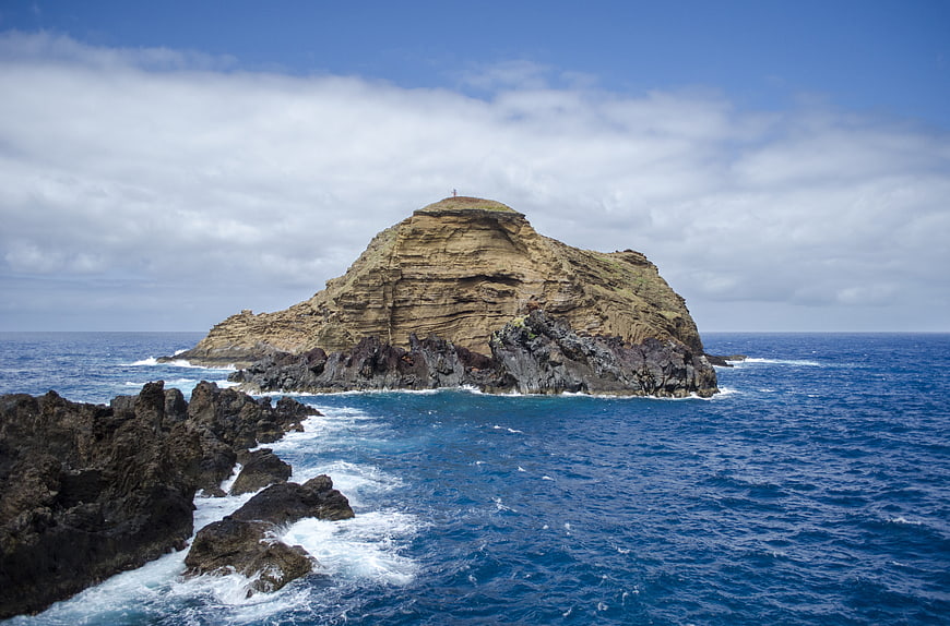 Dramatic coastal rock formation in the blue ocean