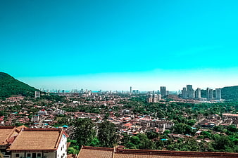 Cityscape with traditional roofs and modern skyline
